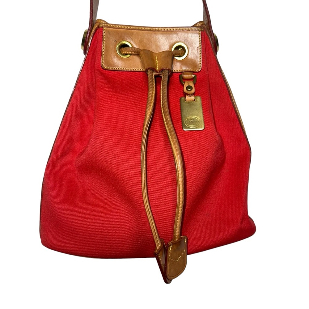 Dooney & Bourke red canvas drawstring bucket bag with tan leather accents